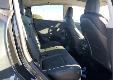 2024 Tesla Model Y from USA, damaged, VIN 7SAYGDED4RF017614